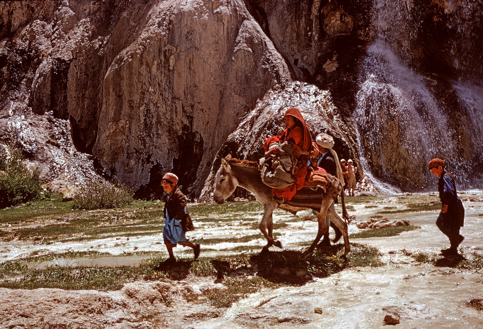 Hazara family, woman and children on donkey back, Band-i-Amir, photo by Françoise Foliot, 1974-1975, Creative Commons Attribution-Share Alike 4.0 International license